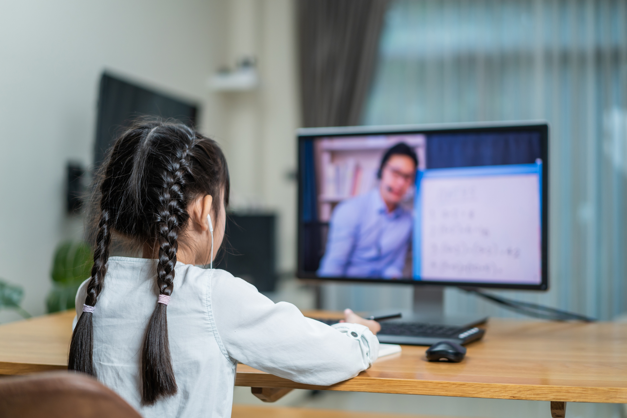 Little Girl Taking Online Class